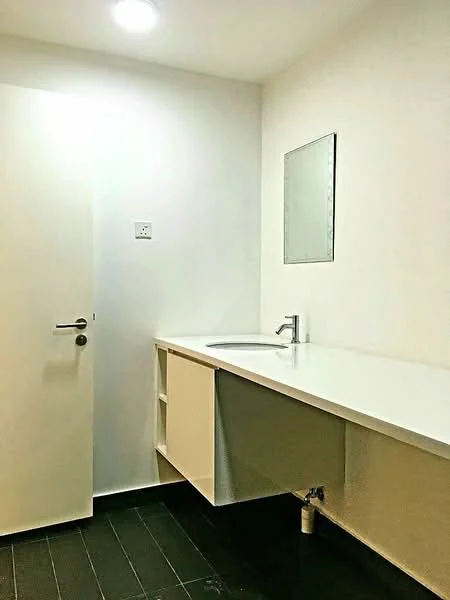Bathroom features: white painted walls, black tiled flooring, floating vanity with white countertop, single-bowl sink, chrome faucet, framed mirror, wall-mounted light fixture, door with handle; style: modern.