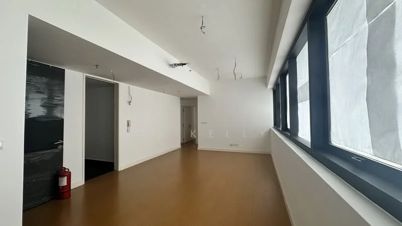 Room features: white painted walls, wooden flooring, large windows, fire extinguisher, ceiling with exposed wiring, open layout, no visible furniture, natural light; style: modern.