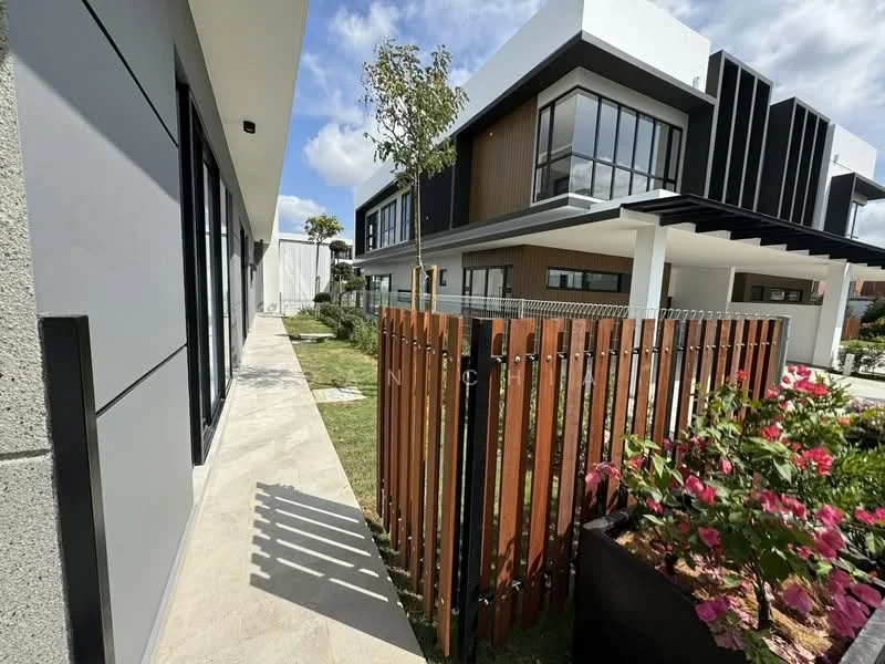 Exterior type: semi-detached house; features: modern facade with a combination of grey and wood cladding, large floor-to-ceiling windows, manicured lawn, decorative wooden fence, paved walkway, landscaped garden with flowering plants, two-storey structure, gated entry; style: modern.