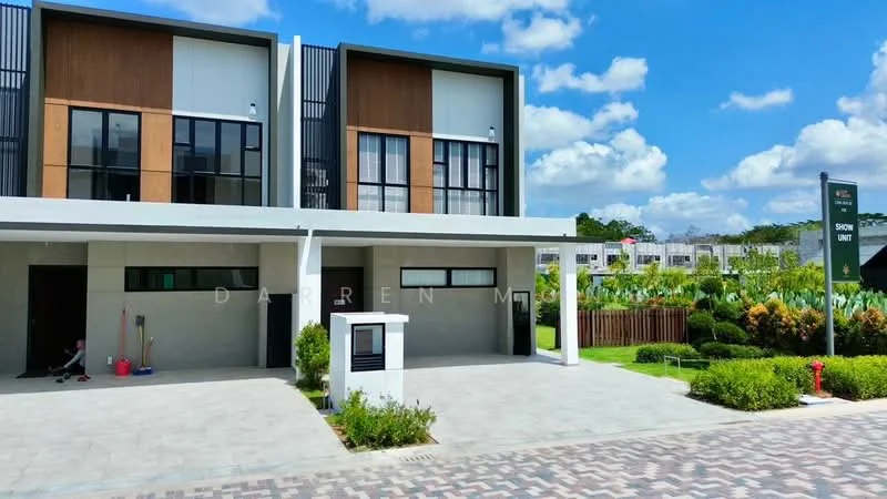 Exterior type: semi-detached house; features: two-storey building, white painted facade, wood panel accents, large windows, manicured lawn, paved driveway, landscaped garden, security sign, clear blue sky, adjacent greenery; style: modern.