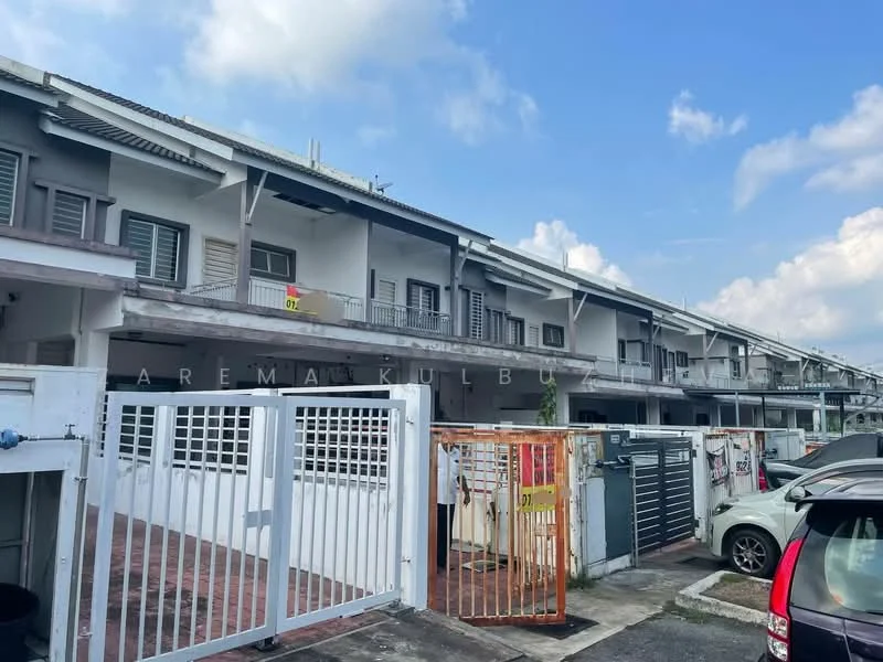 Exterior type: linked terrace house; features: two-storey building, grey painted facade, recessed balconies, metal grilles on windows, front gate with orange color, paved driveway, parking area visible, surrounded by residential area, clear blue sky, clouds in the background; style: modern.