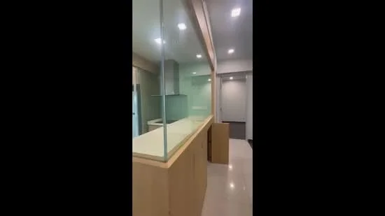 Kitchen features: glass partition, light wood cabinetry, white countertop, built-in appliances, recessed downlights, neutral wall colour, polished tile flooring, open layout; style: modern.
