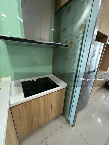 Kitchen features: black glass cooktop, stainless-steel range hood, wood cabinetry, white countertop, green accent wall, refrigerator, ceramic tile flooring, decorative glass panel with leaf pattern; style: modern.