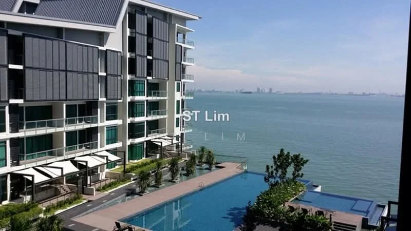 Exterior type: high-rise condominium; features: glass curtain wall, projecting balconies, infinity pool, pool deck with loungers, manicured lawn, tropical landscaping, sea view, surrounded by mature greenery; style: modern.