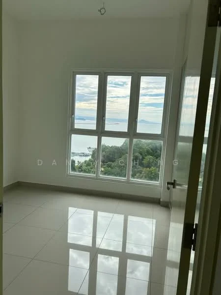 Room features: white painted walls, glossy tile flooring, floor-to-ceiling windows, sea view, natural light from windows, single light fixture on ceiling; style: modern; view: sea.