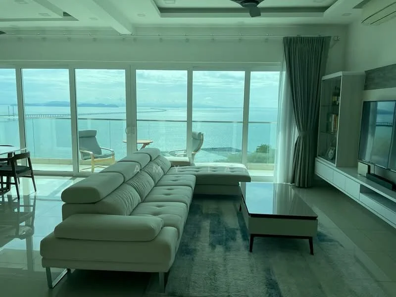 Living features: L-shape sectional sofa in white, coffee table with wooden legs, area rug with abstract pattern, floor-to-ceiling windows, sliding glass door, curtains in grey, wall-mounted TV, entertainment unit with storage, recessed downlights, ceiling fan, marble tile flooring, ocean view; style: modern; view: sea.