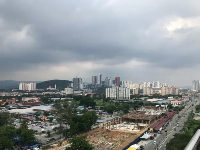 Exterior type: high-rise condominium; features: city skyline view, surrounded by greenery, construction site visible, urban context, multiple high-rise buildings, main road in foreground; style: modern.