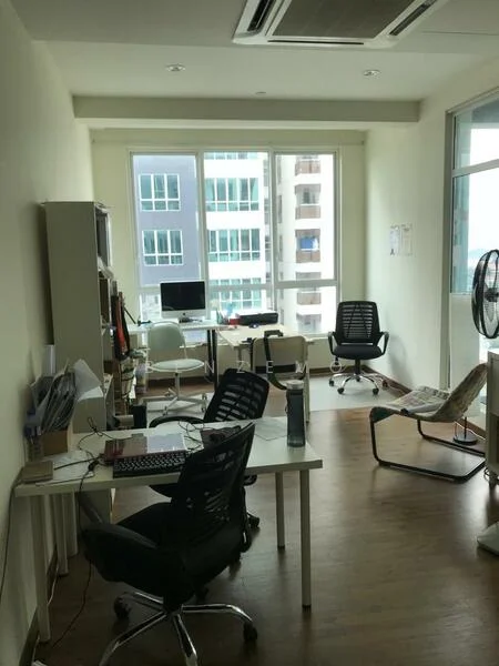Room features: wooden flooring, large floor-to-ceiling windows, white painted walls, ceiling-mounted air conditioning unit, desk with computer monitor, office chair, rolling chair, side table, fan, multiple workstations; style: modern; view: city.