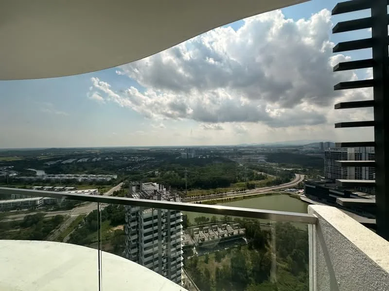 Room features: curved balcony, glass railing, panoramic view, city skyline, river view, cloudy sky, green landscape, high-rise buildings in view; style: modern; view: city.