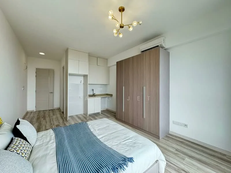 Bedroom features: queen-size bed with white bedding, upholstered headboard, wooden wardrobe with sliding doors, kitchenette with white cabinets, stainless-steel sink, single-bowl stainless-steel sink, chrome pull-down faucet, refrigerator, wooden flooring, ceiling light fixture with multiple bulbs, air conditioning unit, wall-mounted mirror, decorative throw pillows, open shelving above kitchenette; style: modern.