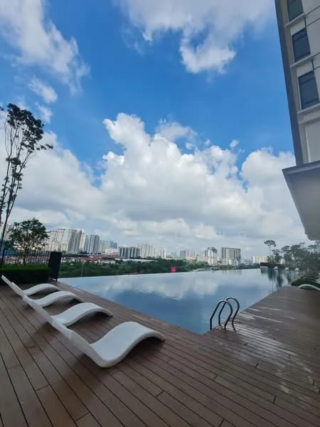Exterior type: swimming pool deck; features: infinity pool, wooden deck flooring, poolside loungers, landscaped greenery, city skyline view, surrounded by trees, clear blue sky, clouds; style: modern.