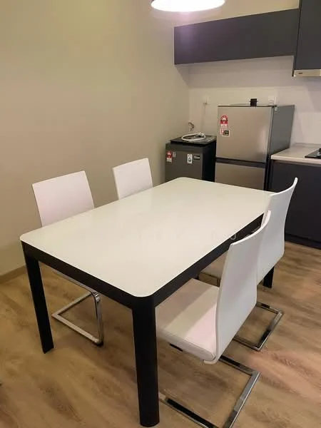 Kitchen features: white dining table with black legs, 4 white dining chairs, stainless-steel fridge, grey cabinetry, black countertop, wood laminate flooring, wall-mounted light fixture, kitchen appliances visible; style: modern.