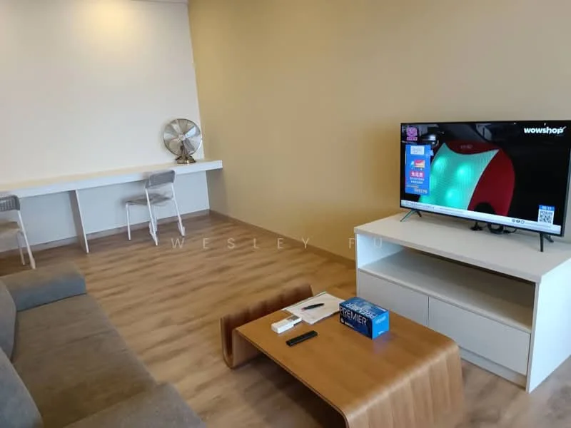 Living features: grey fabric sofa, wooden coffee table, white TV console, wall-mounted TV, floor fan, light wooden flooring, cream painted walls, white desk with chairs; style: modern.