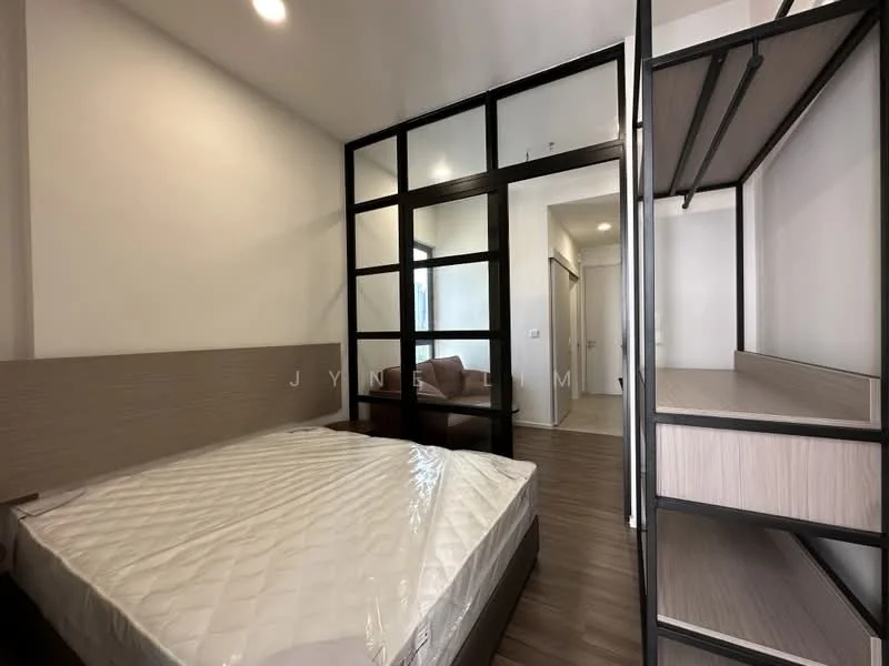 Bedroom features: queen-size bed, wooden bed frame, white mattress with protective cover, glass partition wall, built-in wardrobe with open shelving, wooden flooring, neutral painted walls, recessed ceiling lights; style: modern.