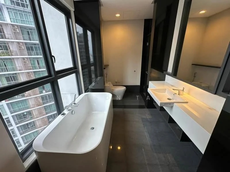 Bathroom features: freestanding bathtub, one-piece toilet, double-sink vanity with white countertop, wall-mounted faucets, large mirror above vanity, black tiled flooring, floor-to-ceiling windows, natural light, minimalist cabinetry, grey accent wall; style: modern; view: city.