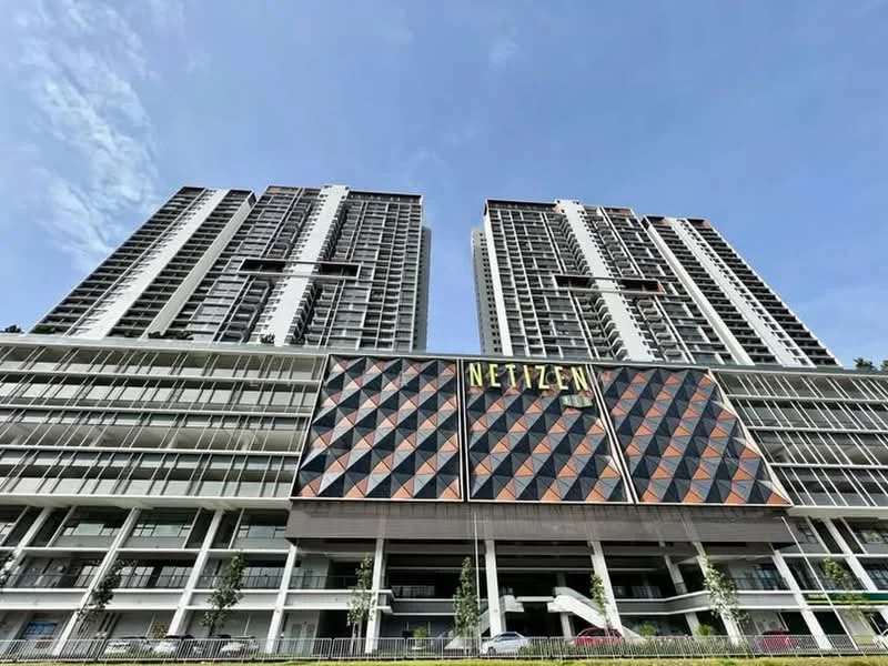 Exterior type: high-rise condominium; features: glass curtain wall, exposed concrete facade, geometric patterned cladding, double-volume main lobby, surrounded by mature greenery, multi-storey car park, balconies on upper floors, modern architectural design; style: modern.