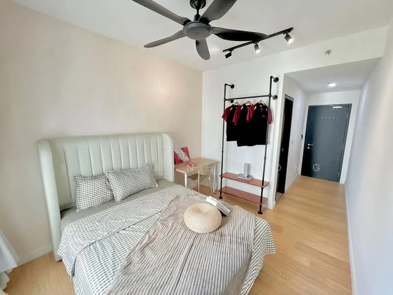 Bedroom features: king-size bed with upholstered headboard, grey and white checkered bedding, wooden bedside table, ceiling fan with light, track lighting, clothing rack with hangers, light wood flooring, white painted walls; style: modern.