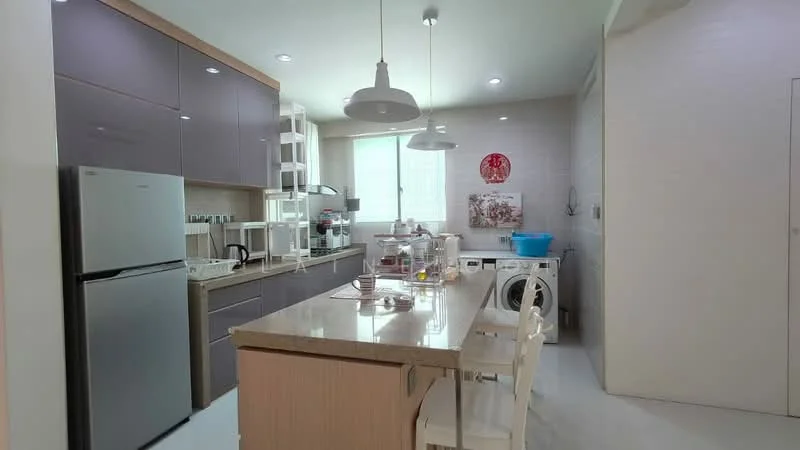 Kitchen features: grey cabinetry, white countertop, stainless-steel fridge, built-in oven, freestanding microwave, dishwasher, kitchen island with seating, white dining chairs, window with natural light, washing machine, open shelving, tile backsplash, recessed lighting; style: modern.