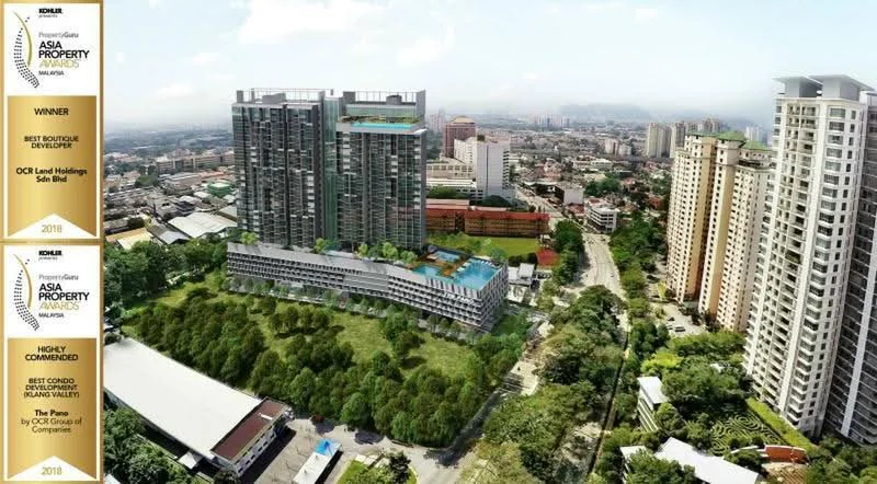 Exterior type: high-rise condominium; features: glass curtain wall, green landscaping, infinity pool, outdoor amenities deck, surrounded by mature greenery, multiple storeys, balconies on upper floors, parking area, urban context with city skyline in background; style: modern.