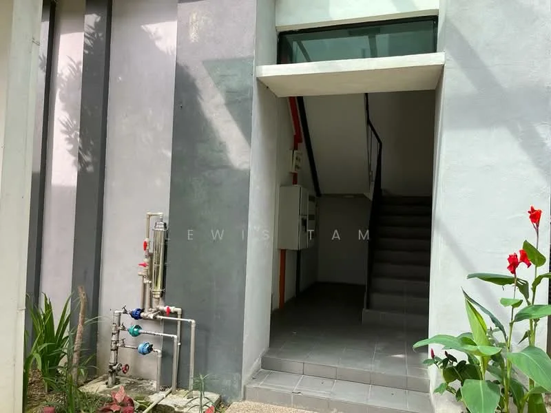 Exterior features: grey painted facade, staircase leading to upper floor, paved walkway, landscaping with plants, utility pipes visible, entrance door, intercom panel, wall-mounted electrical box; style: modern.