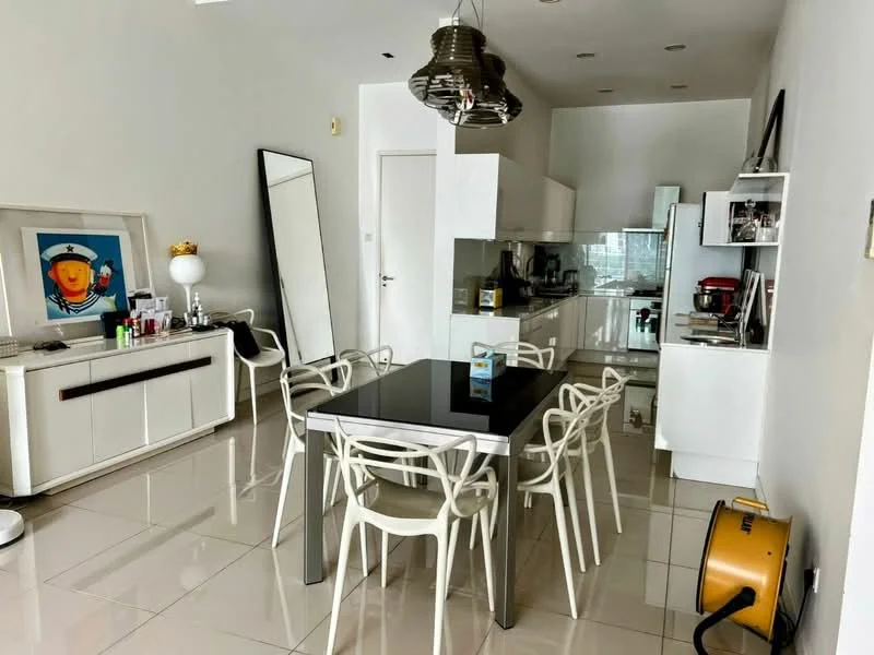 Dining features: white walls, glossy tile flooring, dining table with black surface, 8 white plastic dining chairs, large mirror, framed artwork, pendant light fixture, built-in kitchen cabinetry, stainless-steel appliances, kitchen island, open layout, window with city view; style: modern; view: city.