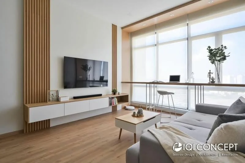 Living features: light grey fabric sofa, wooden coffee table, white media console, wall-mounted flat-screen TV, wood panel accent wall, large floor-to-ceiling windows, light wood flooring, decorative plants, minimalist decor, natural light, open layout with dining area, window treatments, shelves with books and decor items; style: modern; view: city.