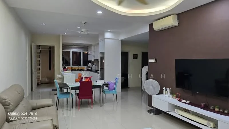 Living features: cream painted walls, white ceiling with recessed lighting, large wall-mounted TV, white TV console, light-colored floor tiles, sofa in beige, dining table with 6 colorful chairs, decorative items on console, air conditioning unit on wall, floor-to-ceiling windows, open layout to kitchen, light fixtures on ceiling; style: modern. Kitchen features: white cabinetry, countertop with bar seating, stainless-steel appliances, open layout to living area, large windows for natural light; style: modern.