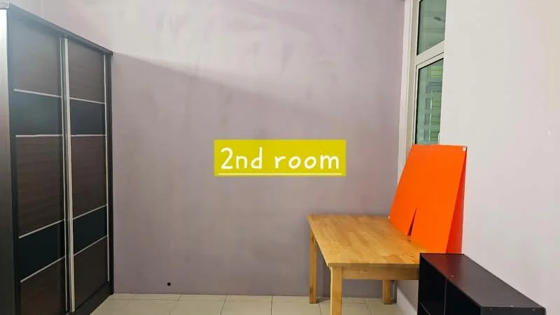 Room features: grey painted walls, tile flooring, large wardrobe with sliding doors, wooden table, black storage unit, window with natural light.