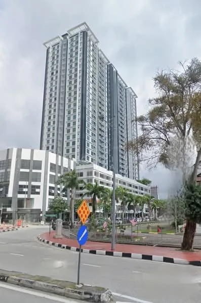 Exterior type: high-rise condominium; features: glass curtain wall, white painted facade, recessed balconies, multiple storeys, surrounded by palm trees, manicured landscaping, driveway with interlocking pavers, urban context with nearby road; style: modern.