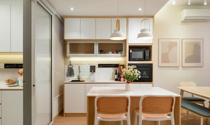 Kitchen features: white cabinetry with wood accents, quartz countertop, single-bowl stainless-steel sink, chrome pull-down faucet, built-in microwave, freestanding range oven, refrigerator, 2 pendant lights above the countertop, open shelving, decorative wall art, wall-mounted air conditioning unit, wooden dining table with 2 chairs; style: modern.