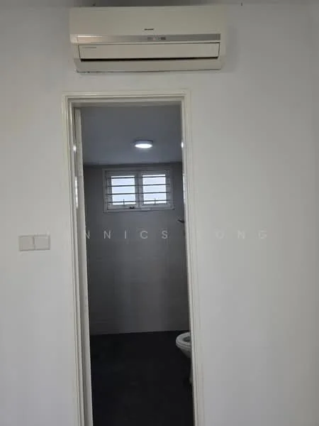 Room features: wall-mounted split AC, white painted walls, grey tile flooring, window with horizontal slats, doorway leading to another room, ceiling light.