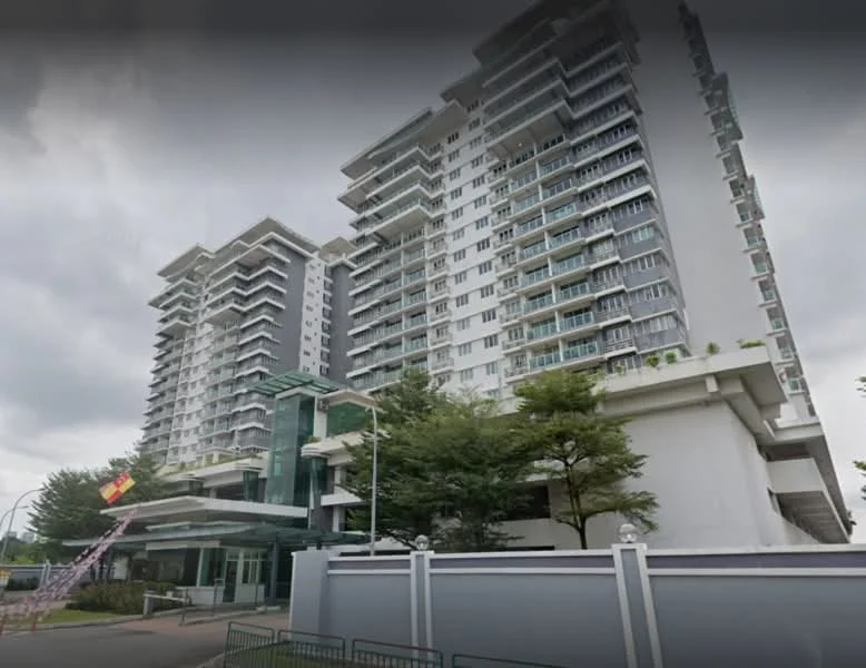 Exterior type: high-rise condominium; features: glass curtain wall, white painted facade, multiple balconies, landscaped garden area, entrance with glass canopy, surrounded by mature trees, security gate, driveway with interlocking pavers; style: modern.