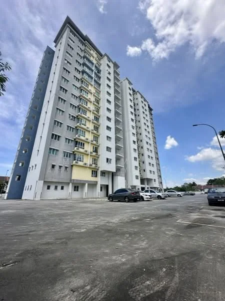 Exterior type: high-rise condominium; features: grey painted facade, yellow accent wall, balconies on upper floors, multiple windows, parking lot in front, surrounding greenery, concrete structure, approximately 10-storey high-rise; style: modern.