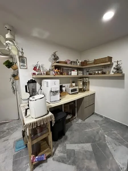 Kitchen features: grey marble tile flooring, white painted walls, wooden countertop, open shelving, microwave, coffee machine, white refrigerator, black trash bin, kitchen cabinets, decorative items on shelves, ceiling fan, wall-mounted light fixture; style: modern.