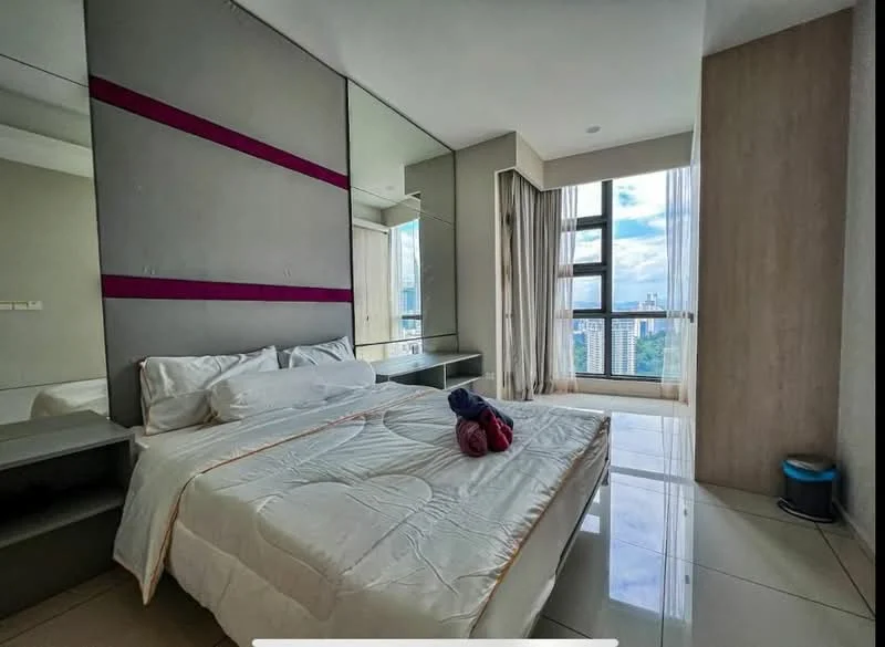 Bedroom features: queen-size bed, white bedding, mirrored wall, grey accent wall, floor-to-ceiling windows, curtains, nightstand with drawers, laminate flooring, decorative towels, wall-mounted mirror, built-in wardrobe; style: modern; view: city.