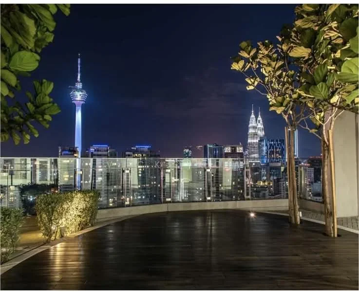 Exterior type: rooftop terrace; features: wooden decking, landscaped greenery, city skyline view, night lighting, glass railing, surrounding urban landscape; style: modern.