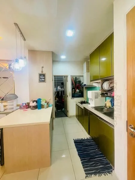 Kitchen features: green cabinetry, white countertop, stainless-steel sink, chrome pull-down faucet, built-in oven, freestanding range oven, microwave, dishwasher, tile flooring, recessed downlights, pendant lighting, open shelving, kitchen island, pantry area, window with blinds; style: modern.