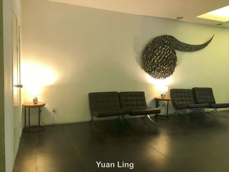 Room features: white painted walls, dark tile flooring, decorative wall art, two side tables, table lamps, seating area with modern chairs; style: modern.