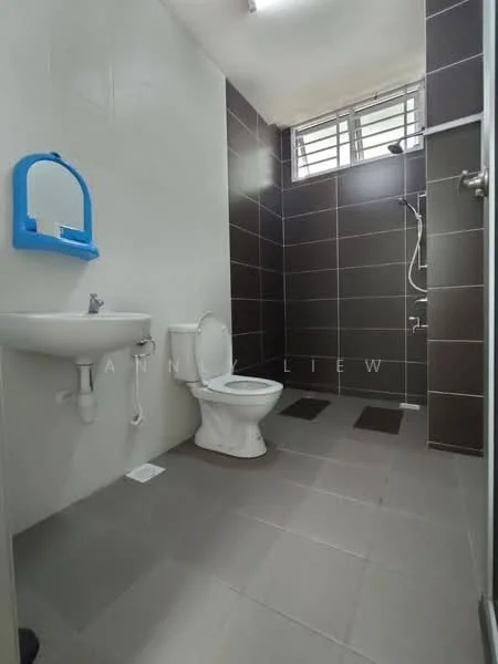 Bathroom features: white ceramic toilet, single-sink vanity with wall-mounted faucet, shower with handheld showerhead, grey ceramic tile flooring, dark tile cladding on walls, window for natural light, mirror above sink, towel rail, drain on floor; style: modern.