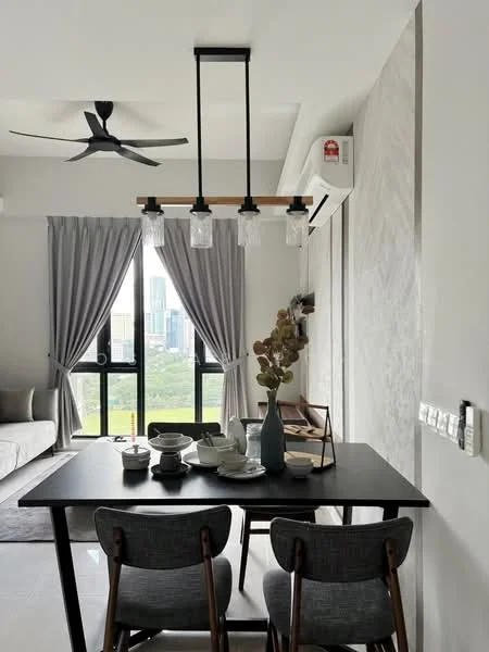 Dining features: 4-seater dining table, black table with wooden legs, 2 grey upholstered dining chairs, pendant light fixture with 3 bulbs, floor-to-ceiling windows, grey curtains, air conditioning unit, decorative vase with dried flowers, ceramic dinnerware set, wall with textured finish, light-coloured flooring, ceiling fan; style: modern; view: city.