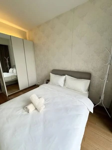 Bedroom features: queen-size bed with white bedding, upholstered headboard in grey, white painted walls with patterned wallpaper, wooden flooring, built-in wardrobe with sliding doors, floor-to-ceiling mirror on wardrobe, decorative towel on bed, natural light from window; style: modern.