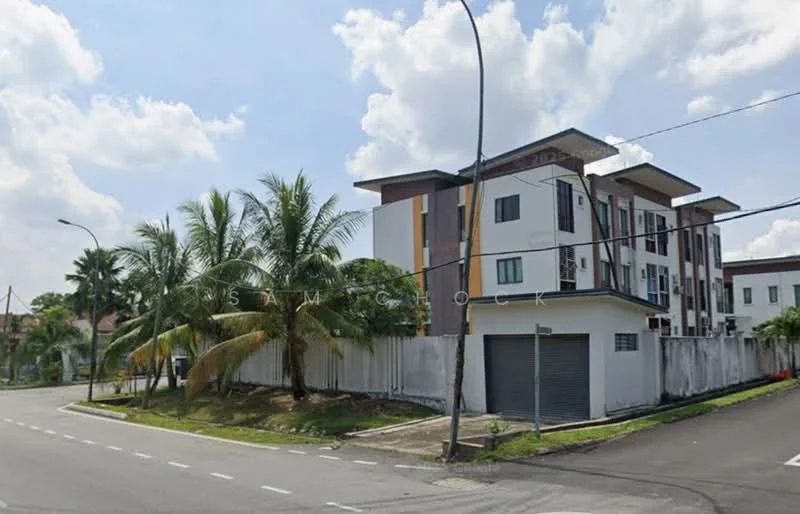 Exterior type: low-rise apartment block; features: white painted facade, brown accent panels, flat roof, surrounded by palm trees, manicured lawn, fenced perimeter, corner lot, driveway, street view, multiple storeys; style: modern.