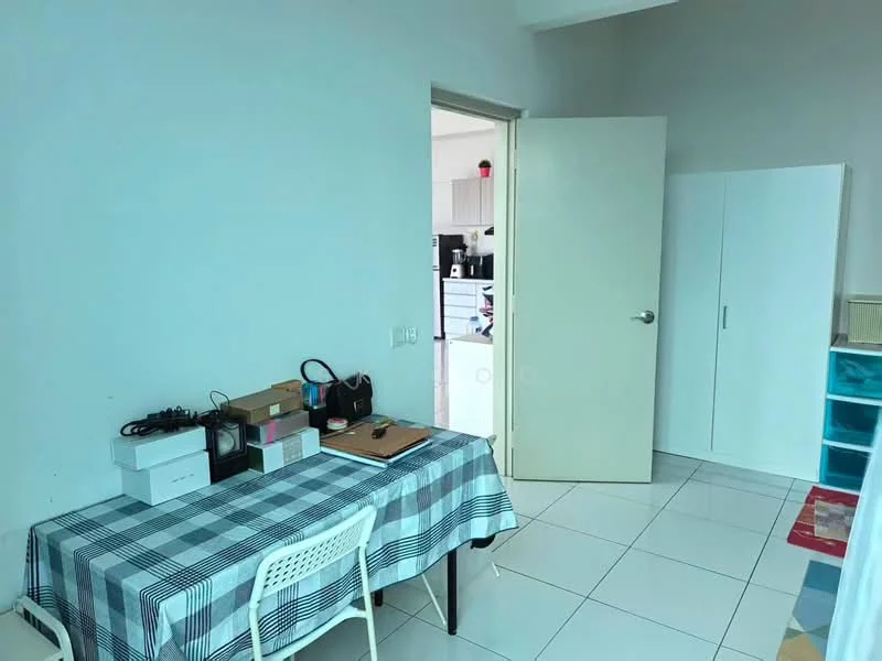 Room features: white painted walls, glossy white tile flooring, table with checkered tablecloth, white plastic chair, open door leading to another room, white cabinet, colorful storage drawers, natural light from doorway; style: modern.