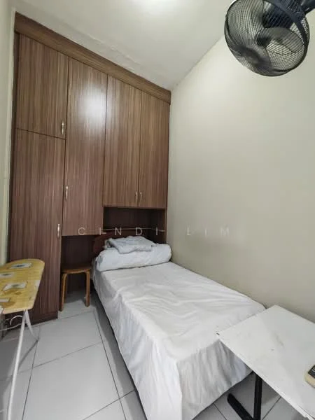 Bedroom features: single bed with white bedding, wooden wardrobe with sliding doors, white walls, white tiled flooring, ceiling fan, small wooden chair, foldable table, natural light from window; style: minimalist.
