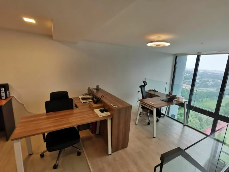Study features: two wooden desks, black office chair, glass partition, large windows with city view, light wood flooring, recessed ceiling lights, desktop computer, stationery items on desk, minimalist decor; style: modern; view: city.