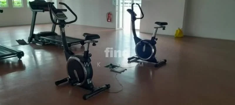 Room features: exercise bikes, treadmill, wooden flooring, large windows, bright lighting, open space, fire extinguisher on wall, yellow cleaning equipment; style: modern.