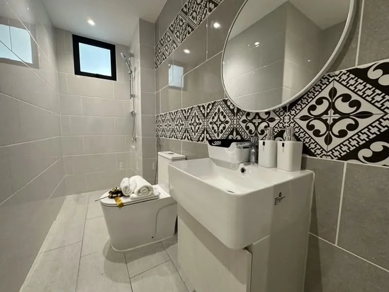 Bathroom features: grey ceramic tile flooring, white tiled walls, decorative black and white patterned wall tiles, round mirror, single-sink vanity with white cabinet, chrome basin mixer faucet, toilet with concealed cistern, glass shower enclosure, handheld shower head, towels neatly arranged, toiletries on countertop, window for natural light; style: modern.