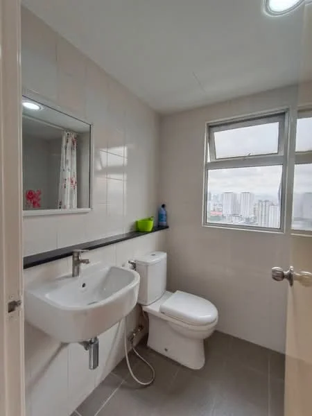 Bathroom features: white tiled walls, grey ceramic tile flooring, single-sink vanity with wall-mounted faucet, framed mirror above sink, one-piece toilet, window with city view, shower hose attachment, white shower curtain, soap dispenser, green plant pot; style: modern; view: city.