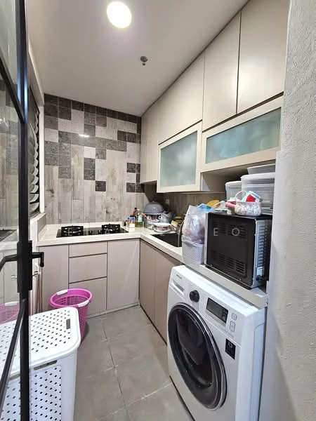 Laundry features: grey tiled flooring, light grey cabinetry, white countertop, built-in gas hob with two burners, stainless-steel sink, front-load washing machine, plastic laundry basket, decorative wall tiles with a mix of patterns, overhead cabinets with frosted glass panels, wall-mounted storage for cleaning supplies; style: modern.