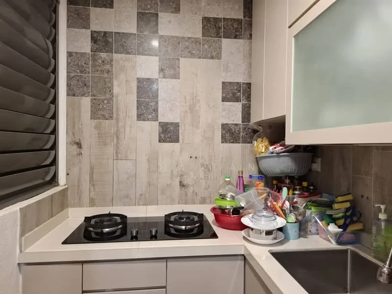 Kitchen features: grey and beige tiled backsplash, light wood paneling on walls, white cabinetry with glass panels, black gas stove with two burners, white countertop, sink with faucet, various kitchen utensils and containers, window with horizontal blinds; style: modern.